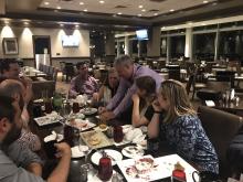 The team playing dinner games post-event.