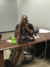One phone is not enough! Pictured is administrative associate, Donna Tillis-Radcliff, getting work done at the office.