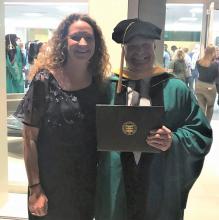 Carrie Pettus-Davis celebrates Bill Rone on his MSW graduation in May 2019 from The Brown School at the Washington University in St. Louis